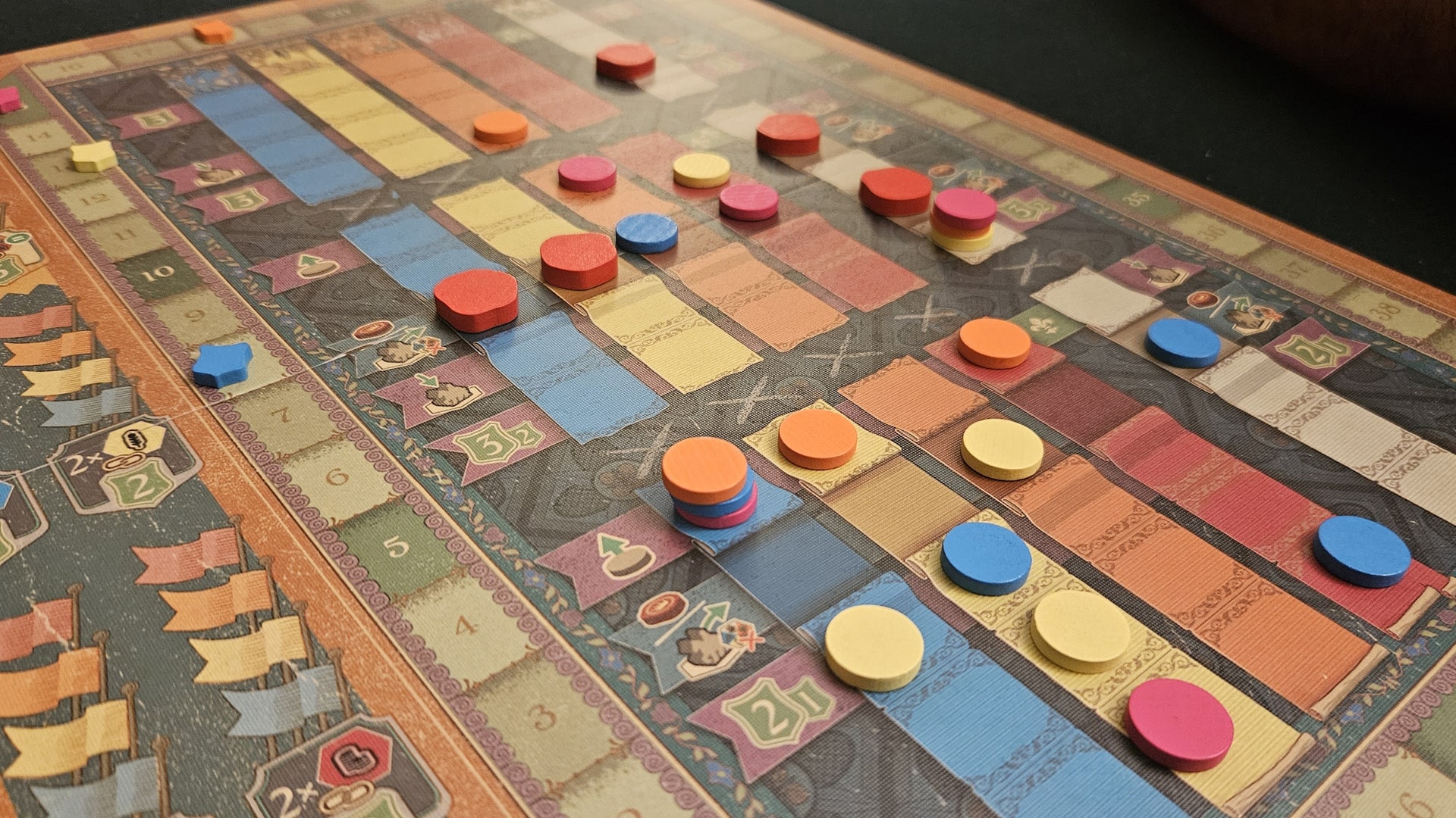 Intricately designed game pieces and board of Cascadero and Cascadito, showcasing the game's unique aesthetic and gameplay elements.