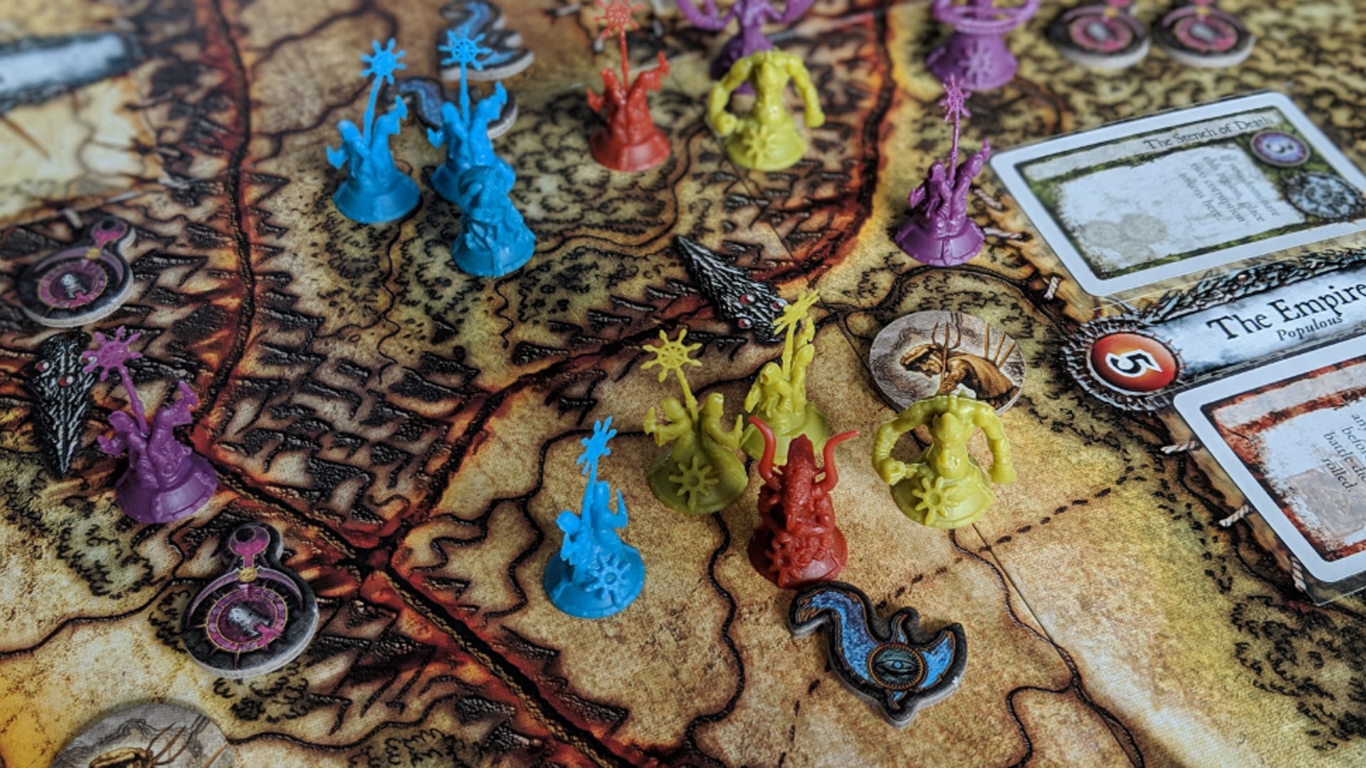 Intricate game board and pieces of 'Chaos in the Old World,' highlighting its dark fantasy theme and strategic gameplay elements.