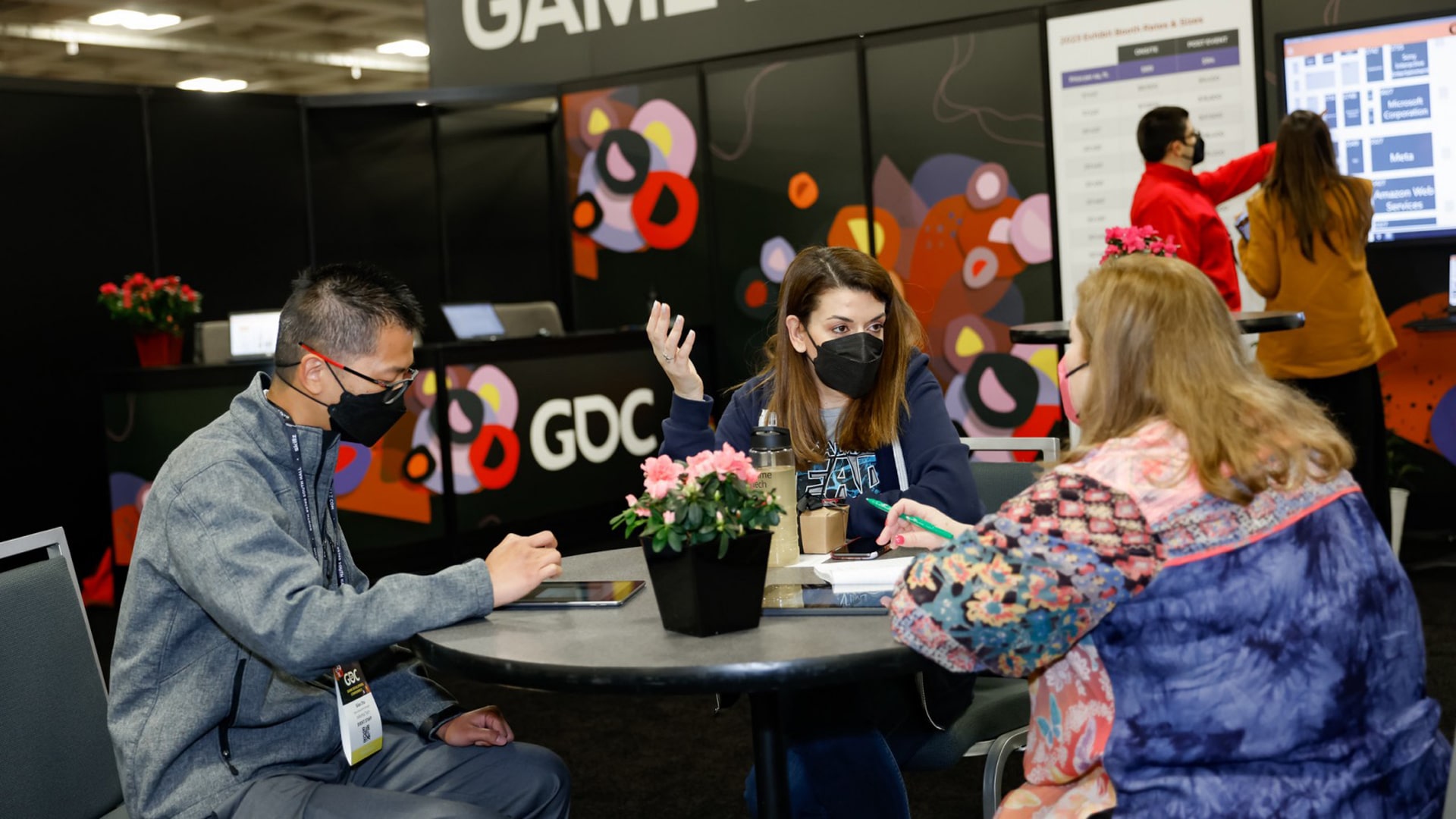 Group of game developers discussing at GDC 2023