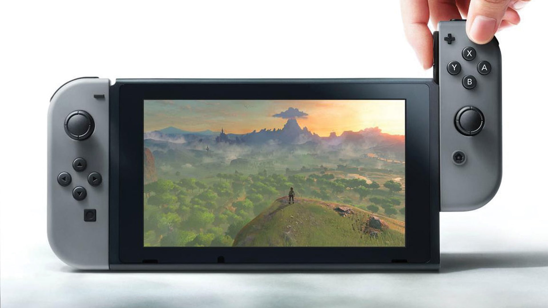 Person holding a Nintendo Switch, showcasing the console's design and portability