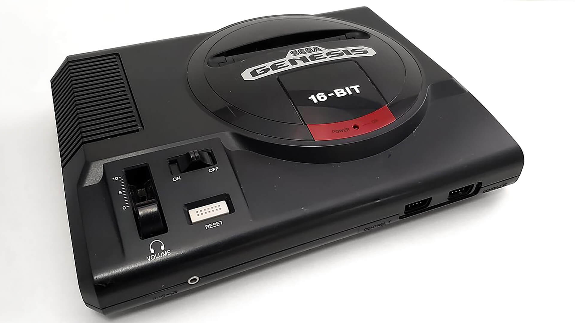 A sleek black Sega Genesis Model 1 console, the iconic 16-bit video game system released in North America, highlighting its classic design and volume slider.